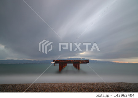 Old abandoned wooden fishing pier on the sea in the countryside 142962404