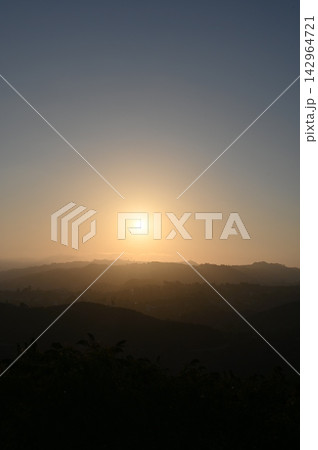 Smoggy Sunset View over Winding Mountain Road in Los Angeles Smoggy Sunset View over Winding Mountain Road in Los Angeles 142964721
