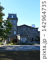 Historic Stone Mansion with Tower and Mansard Roof 142964735