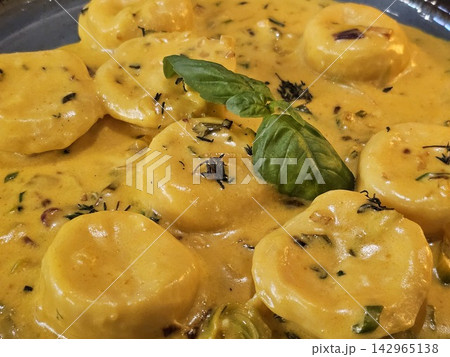 Close View of Sorrentinos in Creamy Herb Sauce 142965138