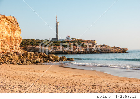 Ponta do Altar lighthouse on cliff in Ferragudo Ponta do Altar lighthouse on cliff in Ferragudo 142965313
