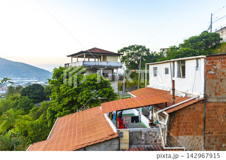 Mountains with favelas houses tropical nature Angra dos Reis Brazil. 142967915