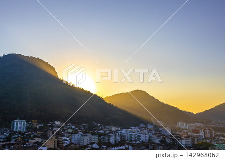 Golden colorful sunrise mountain city Angra dos Reis Brazil. Golden colorful sunrise mountain city Angra dos Reis Brazil. 142968062