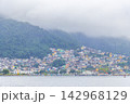 Mountains with favelas houses tropical nature Angra dos Reis Brazil. 142968129