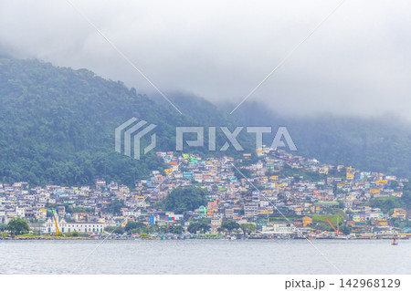 Mountains with favelas houses tropical nature Angra dos Reis Brazil. Mountains with favelas houses tropical nature Angra dos Reis Brazil. 142968129
