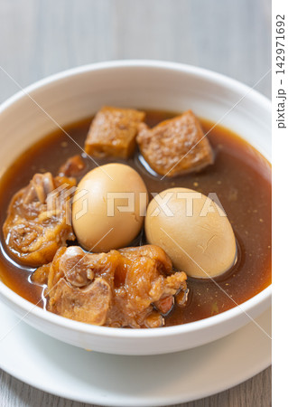 Braised pork soup with egg and tofu, warm savory comfort food Braised pork soup with egg and tofu, warm savory comfort food 142971692