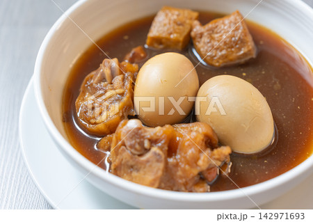 Braised tofu egg stew in dark savory broth with tender chicken and mushroom Braised tofu egg stew in dark savory broth with tender chicken and mushroom 142971693