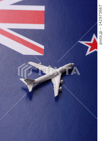 An airplane on the New Zealand flag as a conceptual backdrop for flights and travel An airplane on the New Zealand flag as a conceptual backdrop for flights and travel 142973667