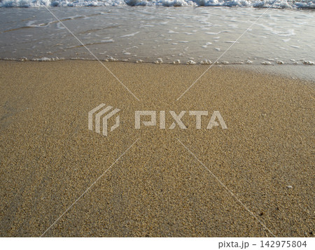 White bubble of Sea wave on the beach White bubble of Sea wave on the beach 142975804