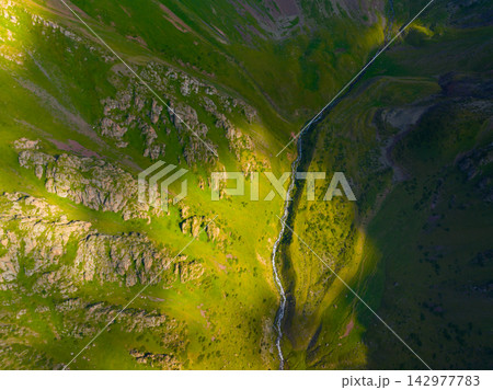 Aerial View of a River Flowing Through a Mountain Landscape Aerial View of a River Flowing Through a Mountain Landscape 142977783