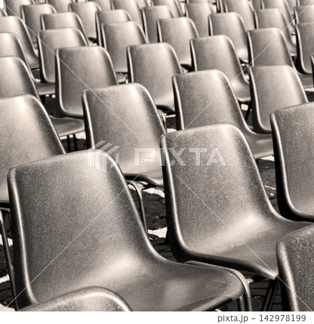 Empty Auditorium Seats in Repeating Black Chair Pattern Empty Auditorium Seats in Repeating Black Chair Pattern 142978199