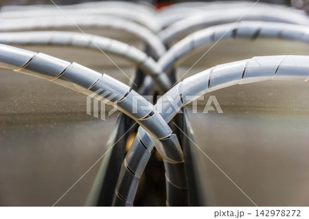 Cable Management Close-Up with Spiral Wire Wrap in Industrial Setup 142978272