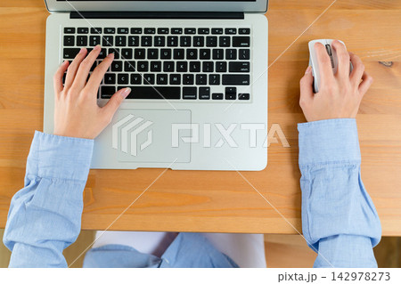 Laptop Keyboard and Mouse on Wooden Desk, Top View Office Workspace 142978273
