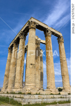 Ancient Greek Temple Columns in Athens Under Blue Sky 142978297
