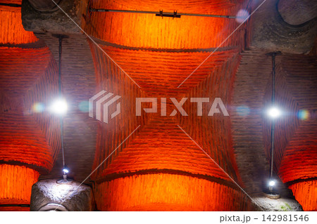 Istanbul, Turkey - August 28, 2026: Architectural ceiling view of illuminated brickwork with orange lighting in a historic building showcasing intricate design elements Istanbul, Turkey - August 28, 2026: Architectural ceiling view of illuminated brickwork with orange lighting in a historic building showcasing intricate design elements 142981546