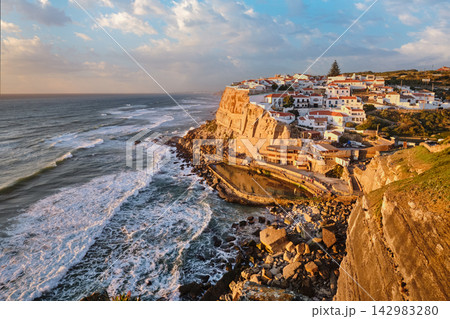 Scenic sunset view of Azenhas do Mar fishing village on Atlantic coast, Portugal. Portugal 142983280