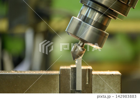 Parts deburring process on an NC milling machine using a chamfer tool Parts deburring process on an NC milling machine using a chamfer tool 142983883