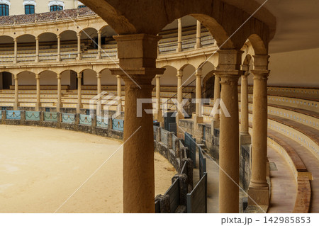Weathered wooden barrier panels along the curved wall of Ronda's bullring Weathered wooden barrier panels along the curved wall of Ronda's bullring 142985853