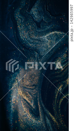 Ink spill. Sparkling fluid. Defocused blue purple color glitter mix acrylic texture floating on abstract art background. Ink spill. Sparkling fluid. Defocused blue purple color glitter mix acrylic texture floating on abstract art background. 142985997