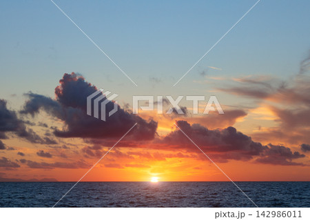 romantic sunset shine light sea scape panorama horizon sky and clouds wallpaper travel photography 142986011