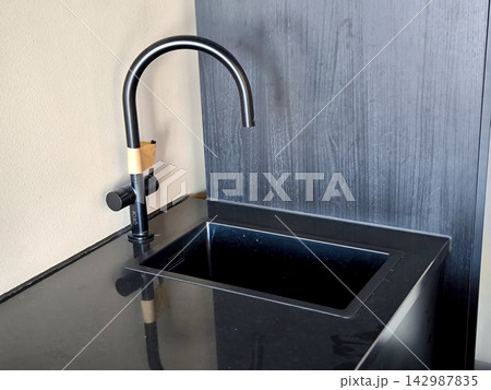 Modern black kitchen faucet and sink 142987835