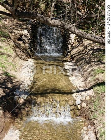 Small Cascading Waterfall in Cordoba Botanical Garden Small Cascading Waterfall in Cordoba Botanical Garden 142987865