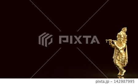Golden Lord Krishna Playing Flute on Dark Background with Copy Space 3d render. 142987995