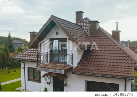 Corrugated metal roof and metal roofing. Modern roof made of met Corrugated metal roof and metal roofing. Modern roof made of met 142988779