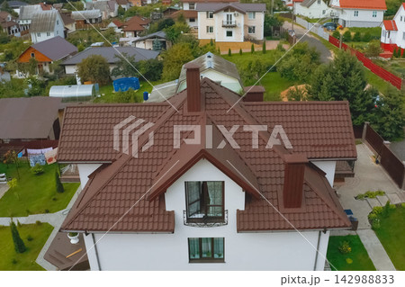 Corrugated metal roof and metal roofing. Modern roof made of met 142988833