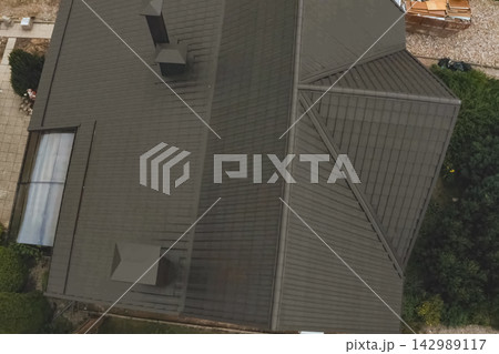 Corrugated metal roof and metal roofing. Modern roof made of metal. 142989117