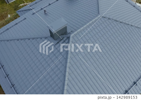 Corrugated metal roof and metal roofing. Modern roof made of metal. Corrugated metal roof and metal roofing. Modern roof made of metal. 142989153