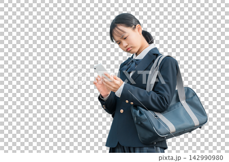 Female junior high school students and high school students in uniforms who are troubled, worried, or thinking while looking at their smartphones Female junior high school students and high school students in uniforms who are troubled, worried, or thinking while looking at their smartphones 142990980