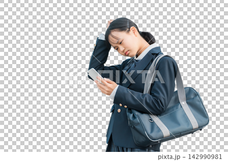 Female junior high school students and high school students in uniforms who are troubled, worried, or thinking while looking at their smartphones Female junior high school students and high school students in uniforms who are troubled, worried, or thinking while looking at their smartphones 142990981