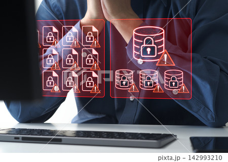 コンピューターシステム上のファイルやデータを暗号化するランサムウェア攻撃。重要なビジネスデータへのア コンピューターシステム上のファイルやデータを暗号化するランサムウェア攻撃。重要なビジネスデータへのア 142993210