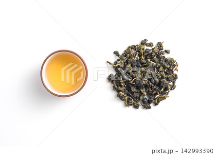 Top view of traditional taiwan oolong tea set and loose tea leaves on white background with copy space 142993390
