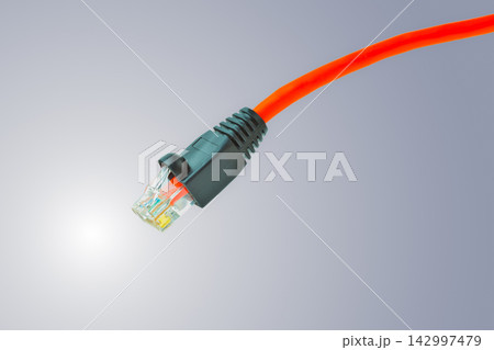 Ethernet Cable RJ45 Connector on Gray Technology Background Ethernet Cable RJ45 Connector on Gray Technology Background 142997479