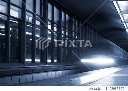 Modern Train Station Platform with Motion Blur Light Trails 142997571