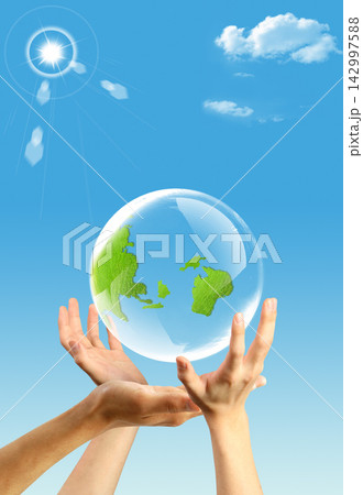 Eco Earth Globe in Hands Under Blue Sky Eco Earth Globe in Hands Under Blue Sky 142997588