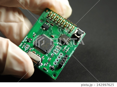 Circuit Board Close-Up with Microchip and Electronic Components 142997625