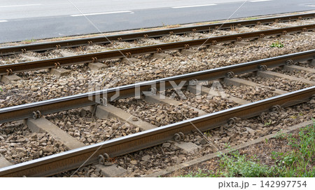 Tram rail track in street, public tramway railroad 142997754