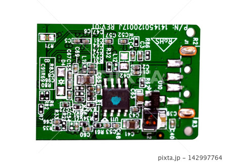 Green Printed Circuit Board Close-Up on White Background 142997764