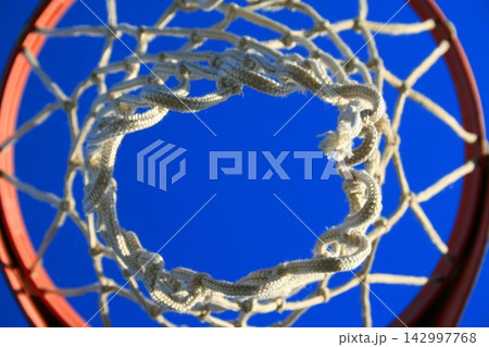 Basketball Hoop Net Close-Up Against Blue Sky Basketball Hoop Net Close-Up Against Blue Sky 142997768