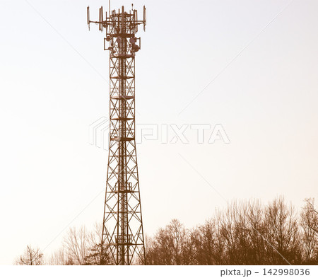 Cell Tower Antennas Against Pale Sky in Minimal Telecom Landscape Cell Tower Antennas Against Pale Sky in Minimal Telecom Landscape 142998036
