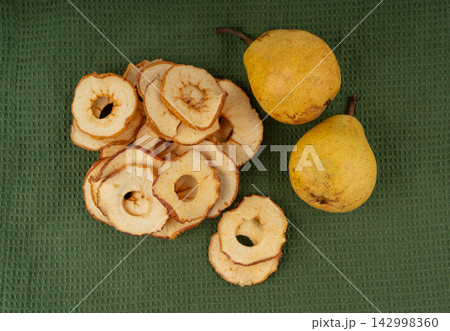 Dry pear slices , dried apple chips, healthy fruit snack 142998360