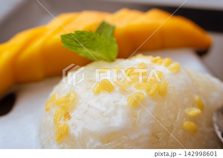Mango sticky rice, thai coconut and fruit dessert Mango sticky rice, thai coconut and fruit dessert 142998601