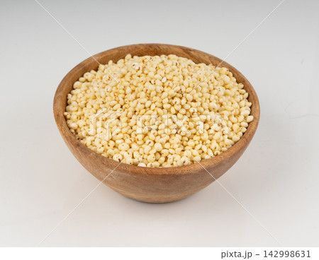 Puffed millet isolated, crispy cereal breakfast, ancient healthy food Puffed millet isolated, crispy cereal breakfast, ancient healthy food 142998631