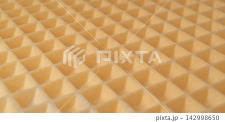 Waffle textured background, crispy wafer cake pattern 142998650