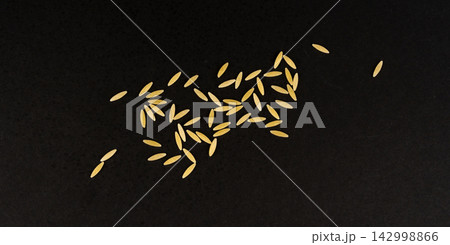 Raw orzo pasta, risoni or kritharaki pile 142998866