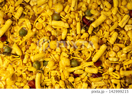 Khatta meetha namkeen textured background Khatta meetha namkeen textured background 142999215