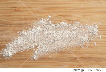 Wheat flour powder textured background, spelt grain dust pattern Wheat flour powder textured background, spelt grain dust pattern 142999272